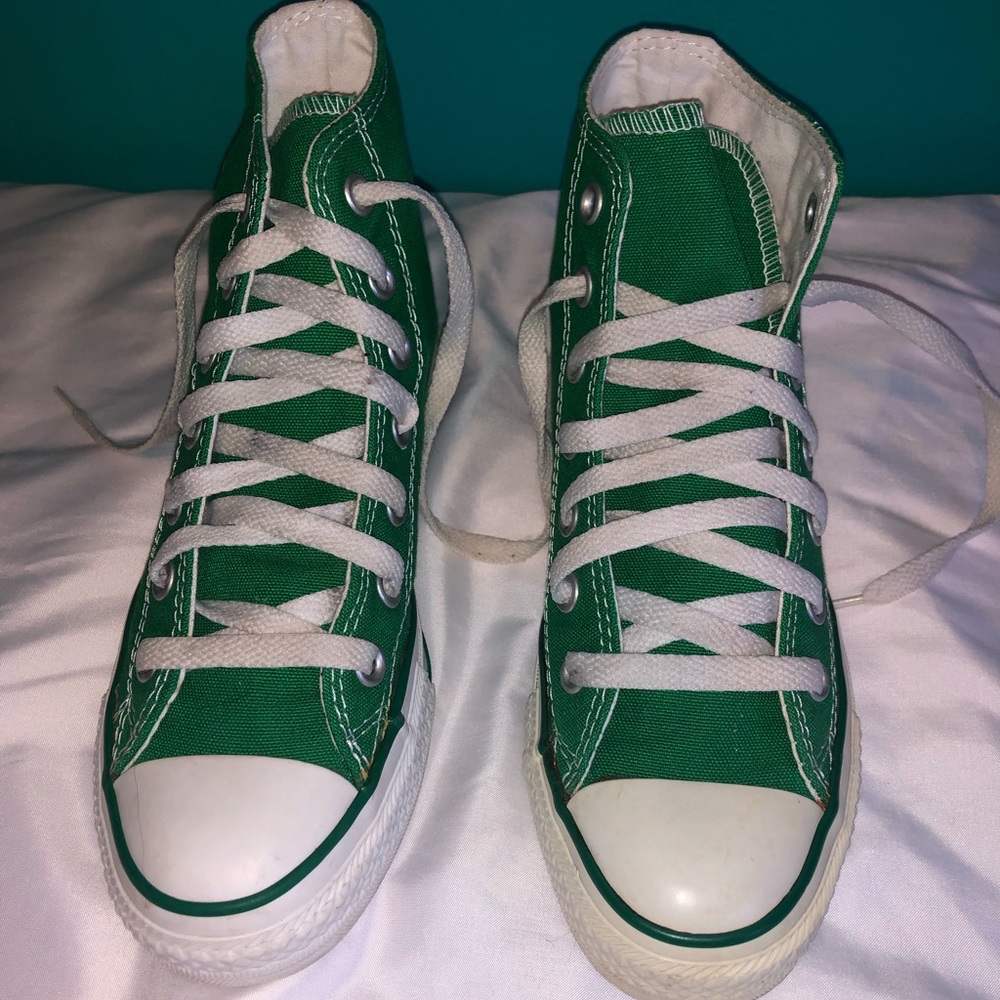 Women’s high-top green converse.